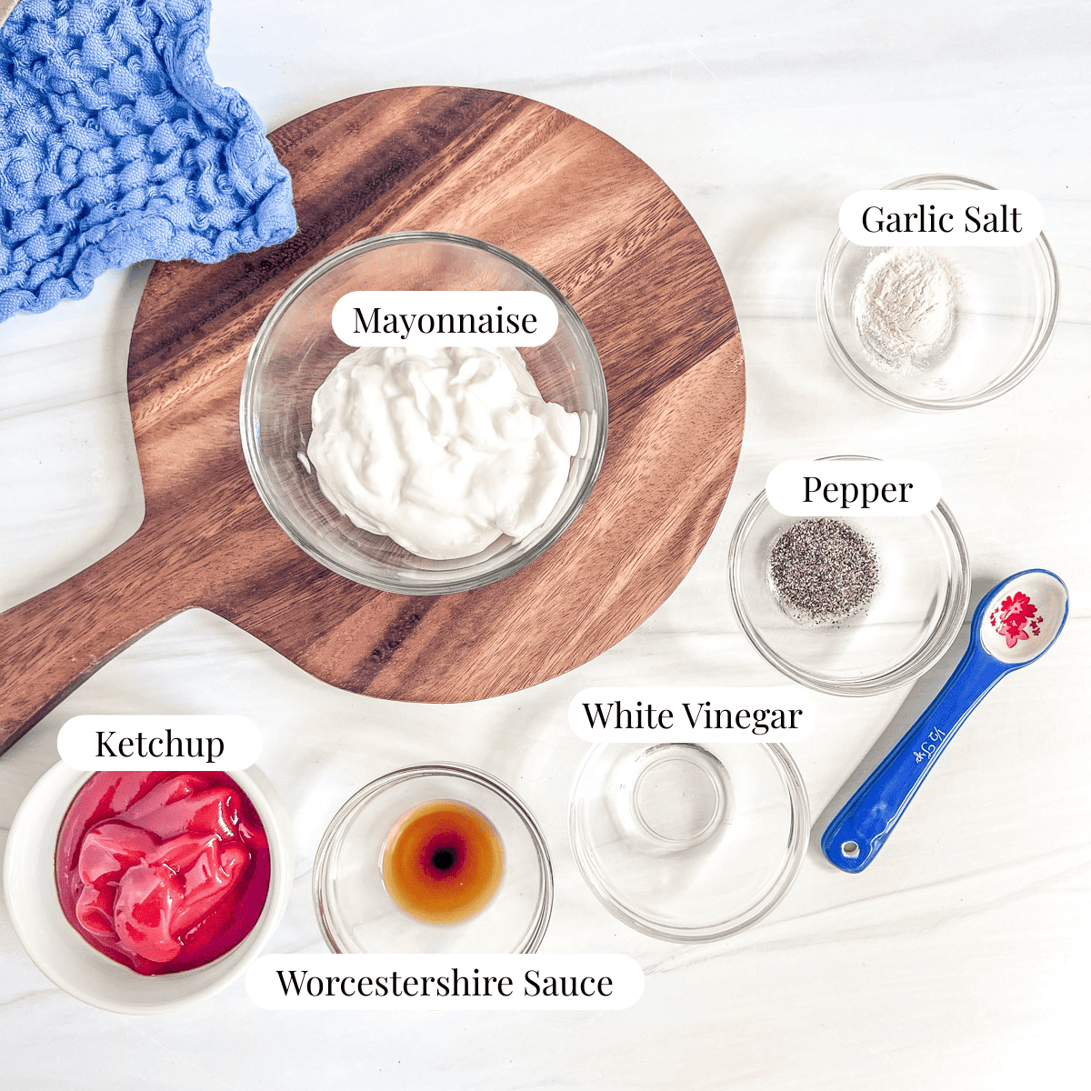 bowl of mayonnaise, garlic salt in a bowl, pepper in a bowl, white vinegar in a bowl, worcestershire sauce in a bowl, ketchup in a bowl