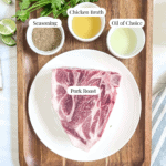 pork roast on a plate, bowl of seasoning, bowl with oil in it, bowl with chicken broth in it