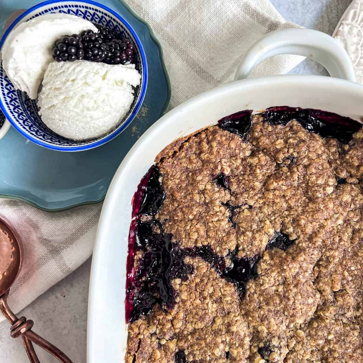 Blackberry Cobbler close up and ice cream above it