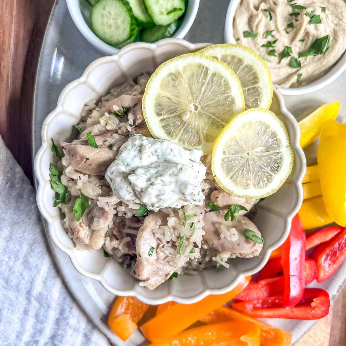 Instant Pot Greek Chicken & Rice close up with tzatziki on top