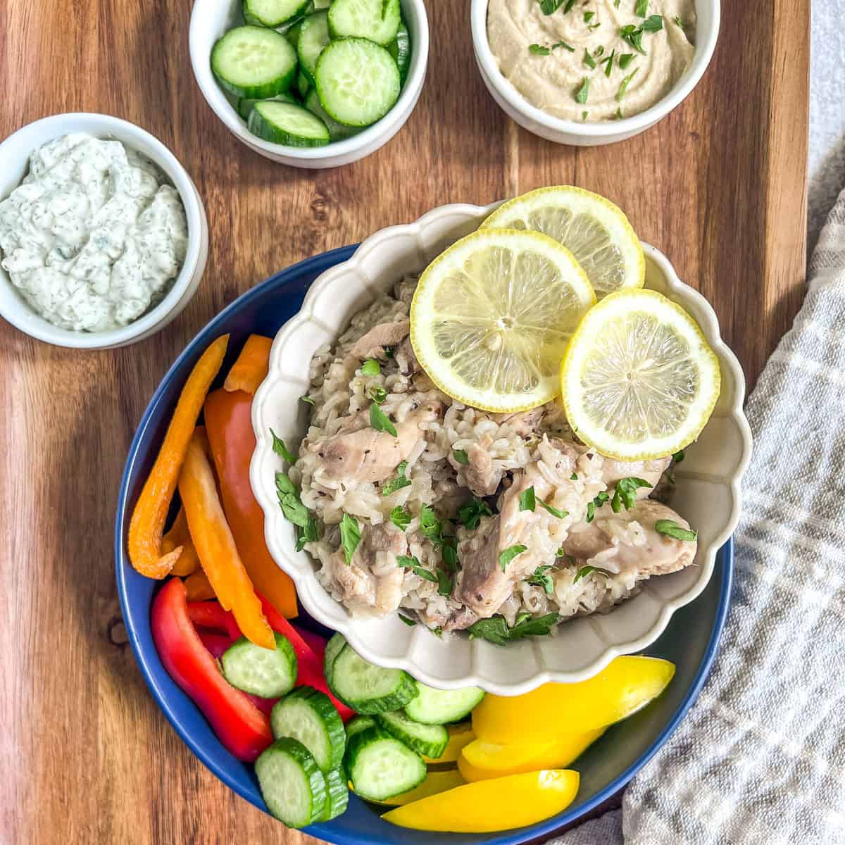 Instant Pot Greek Chicken & Rice in a bowl with peppers on the side