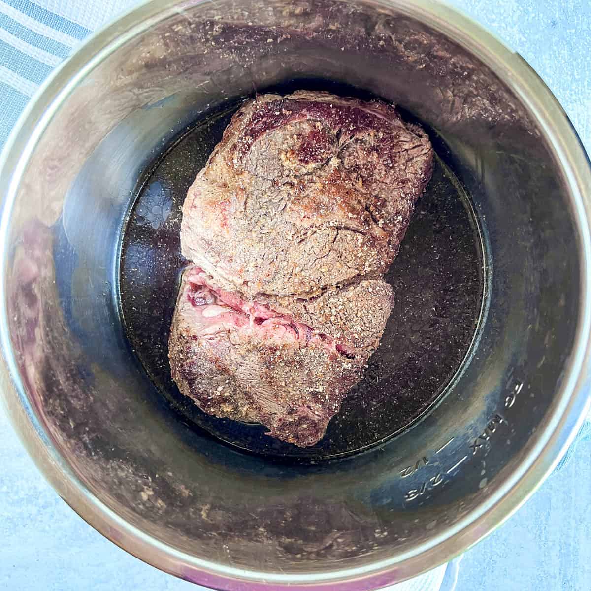 Slow Cooker Pot roast in slow cooker with broth