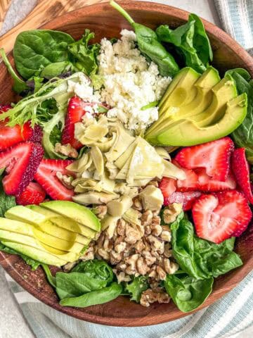 Strawberry Walnut Salad ingredients in a bowl