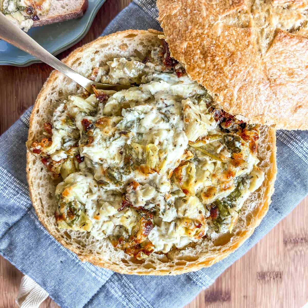 Hot spinach dip in bread bowl