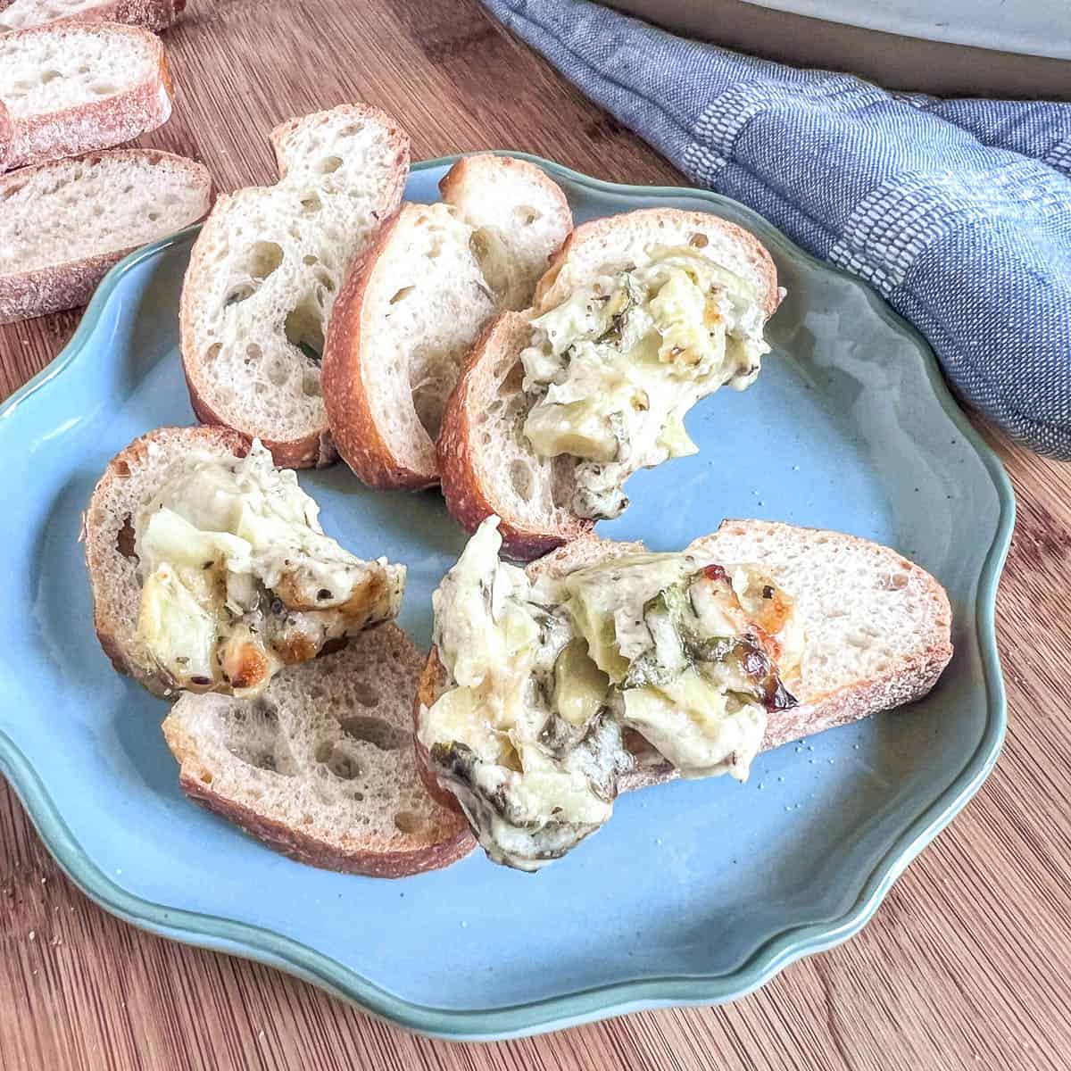 Hot spinach dip on pieces of bread