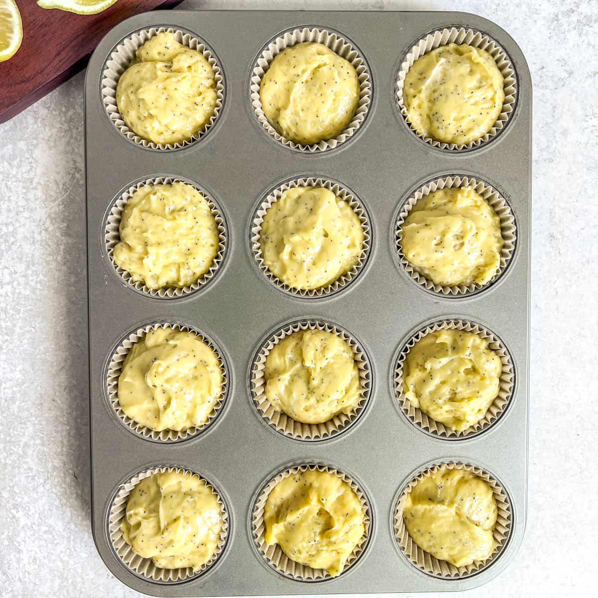 Poppy Seed Muffins batter in muffin tin