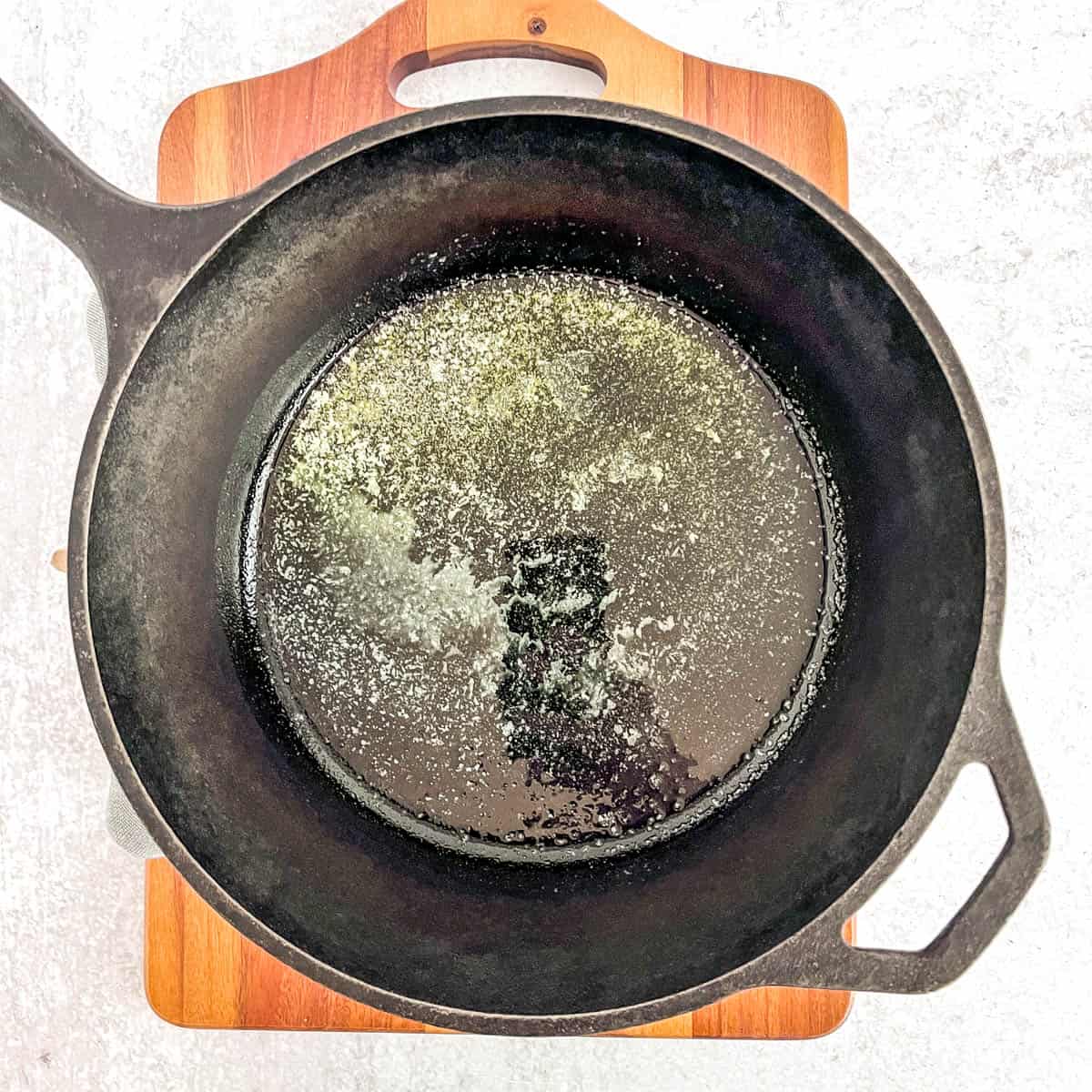 simple dutch baby cast iron skillet with melted butter