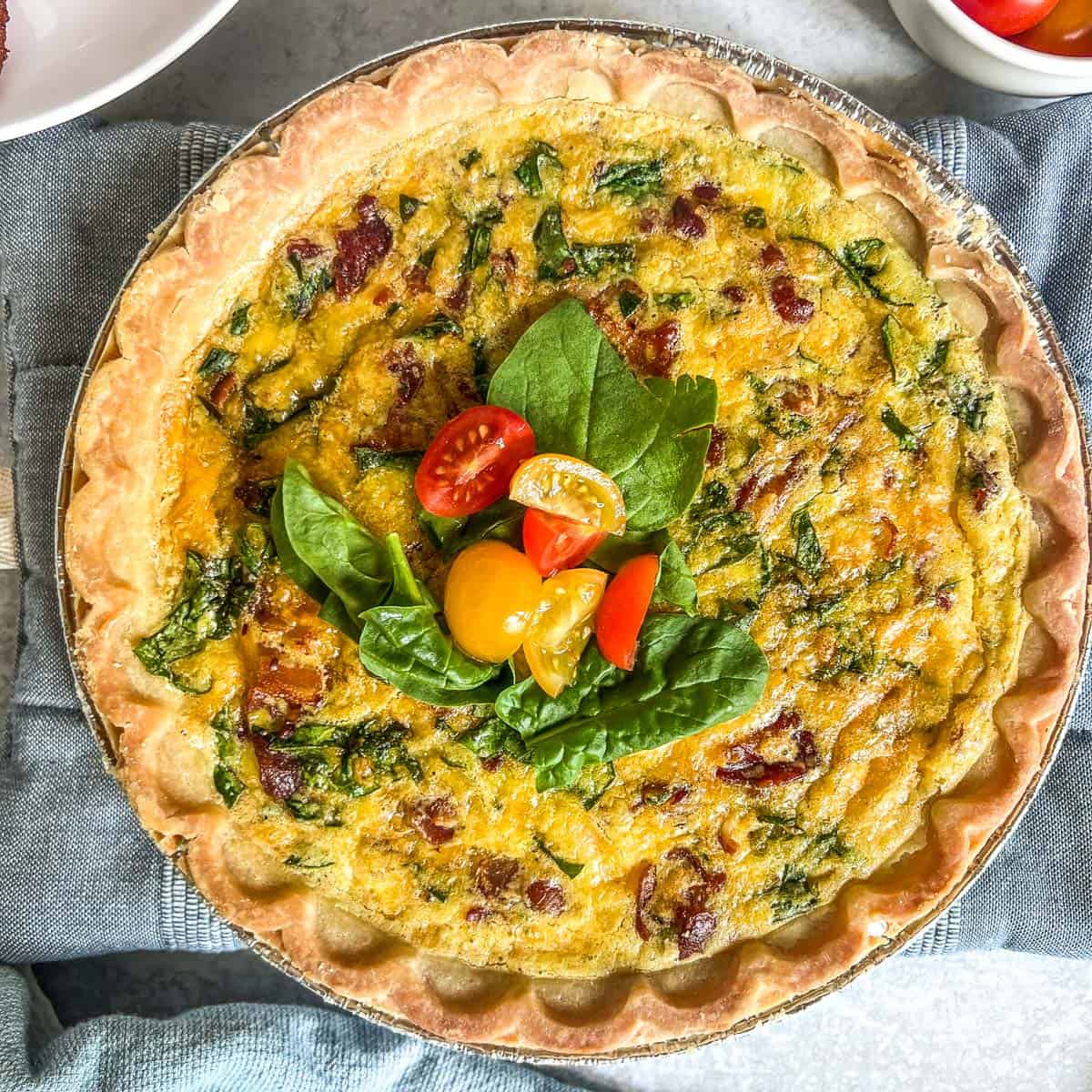 easy quiche baked with spinach on top