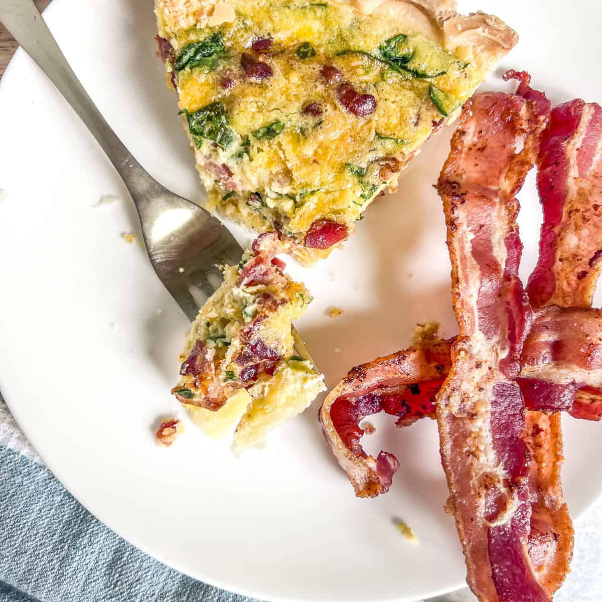 easy quiche with a piece on a fork