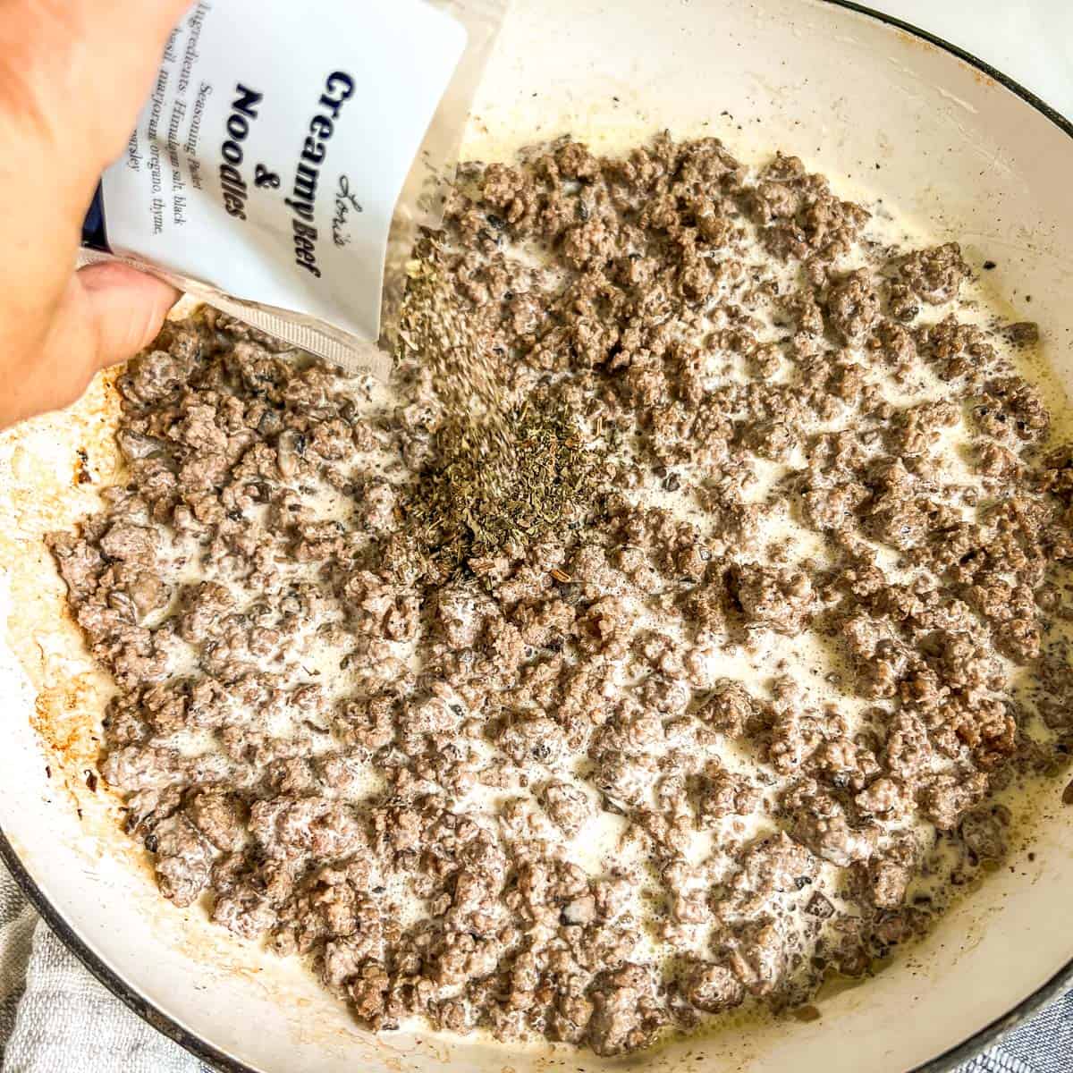 ground beef stroganoff recipe ground beef with cream and seasonings in a pan