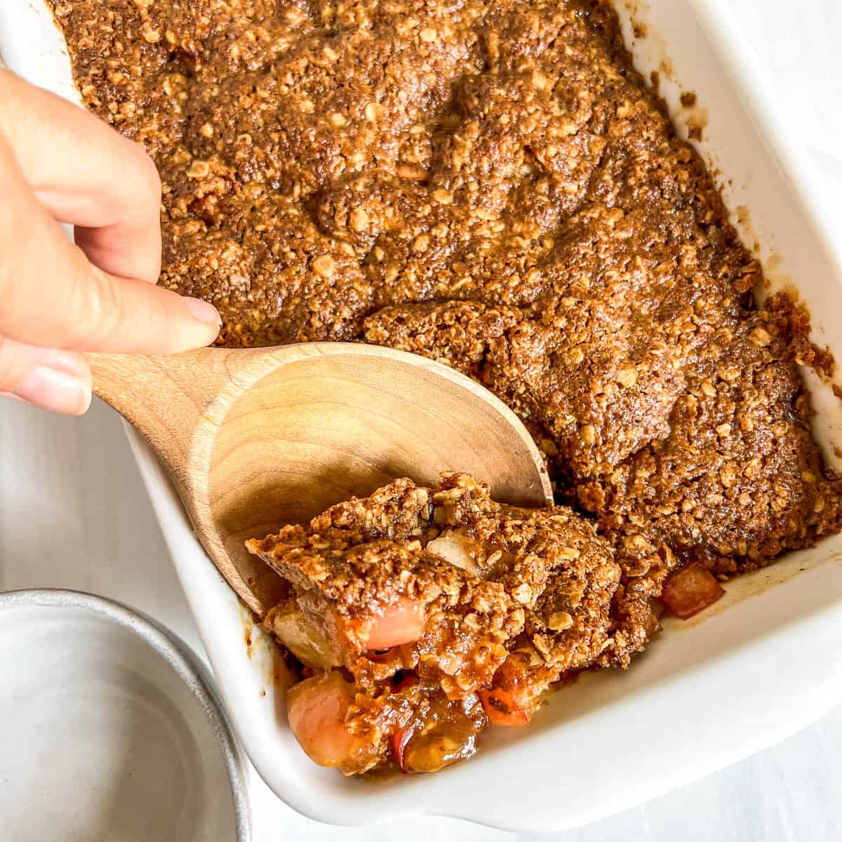 apple dessert with wood spoon