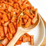 Baked carrots with wood spoon