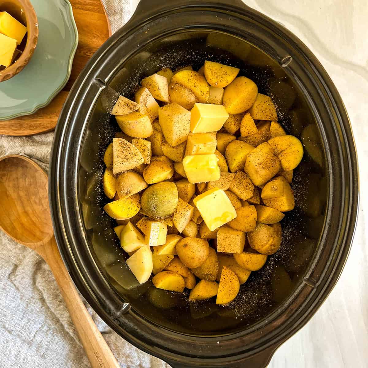 cut up potatoes with butter uncooked