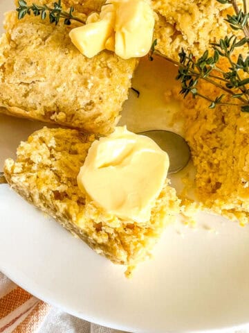 slice of cornbread with a dollop of butter on top