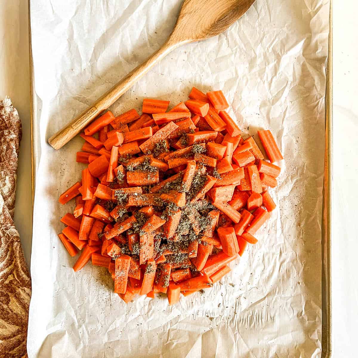 uncooked carrots on baking sheet