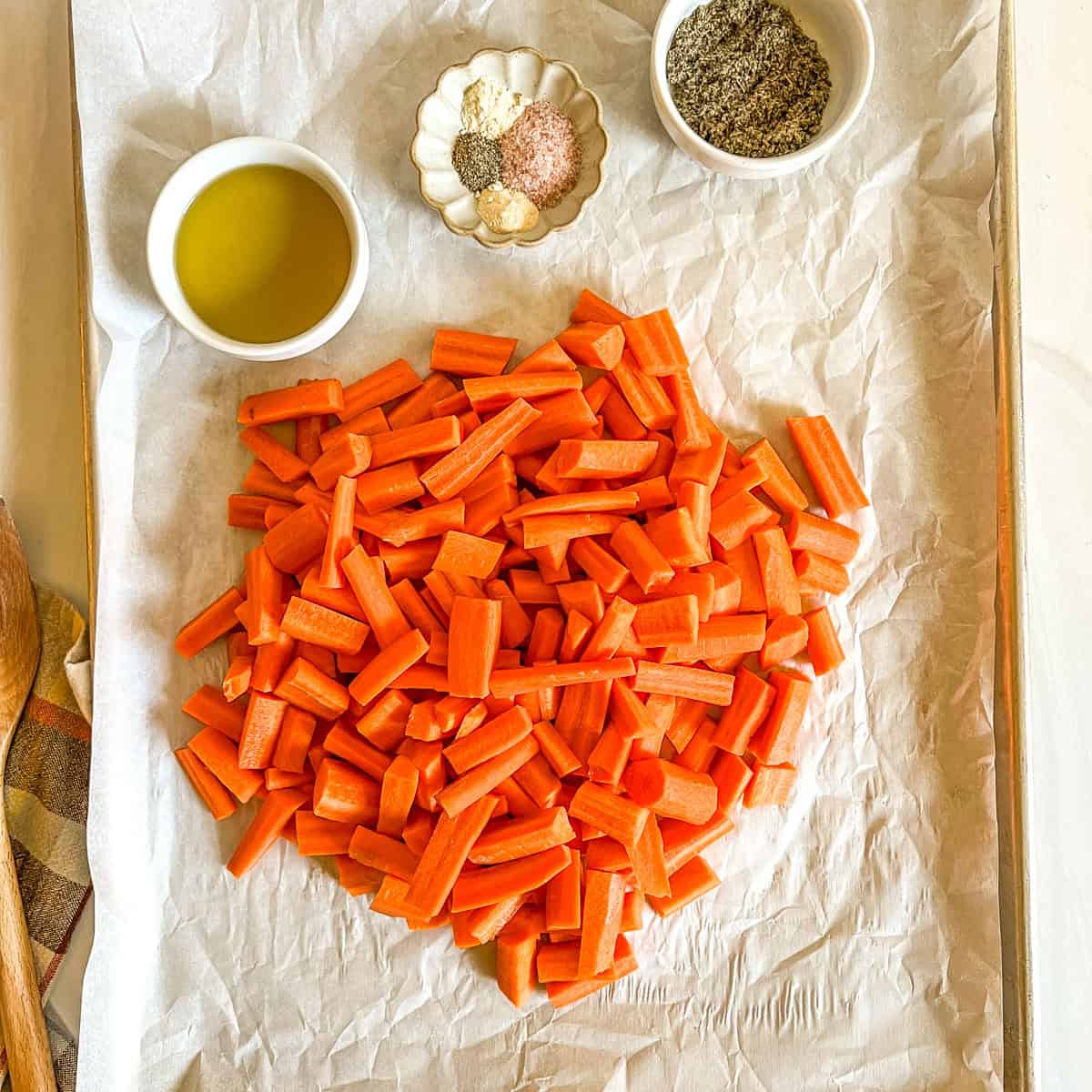 uncooked carrots on parchment paper