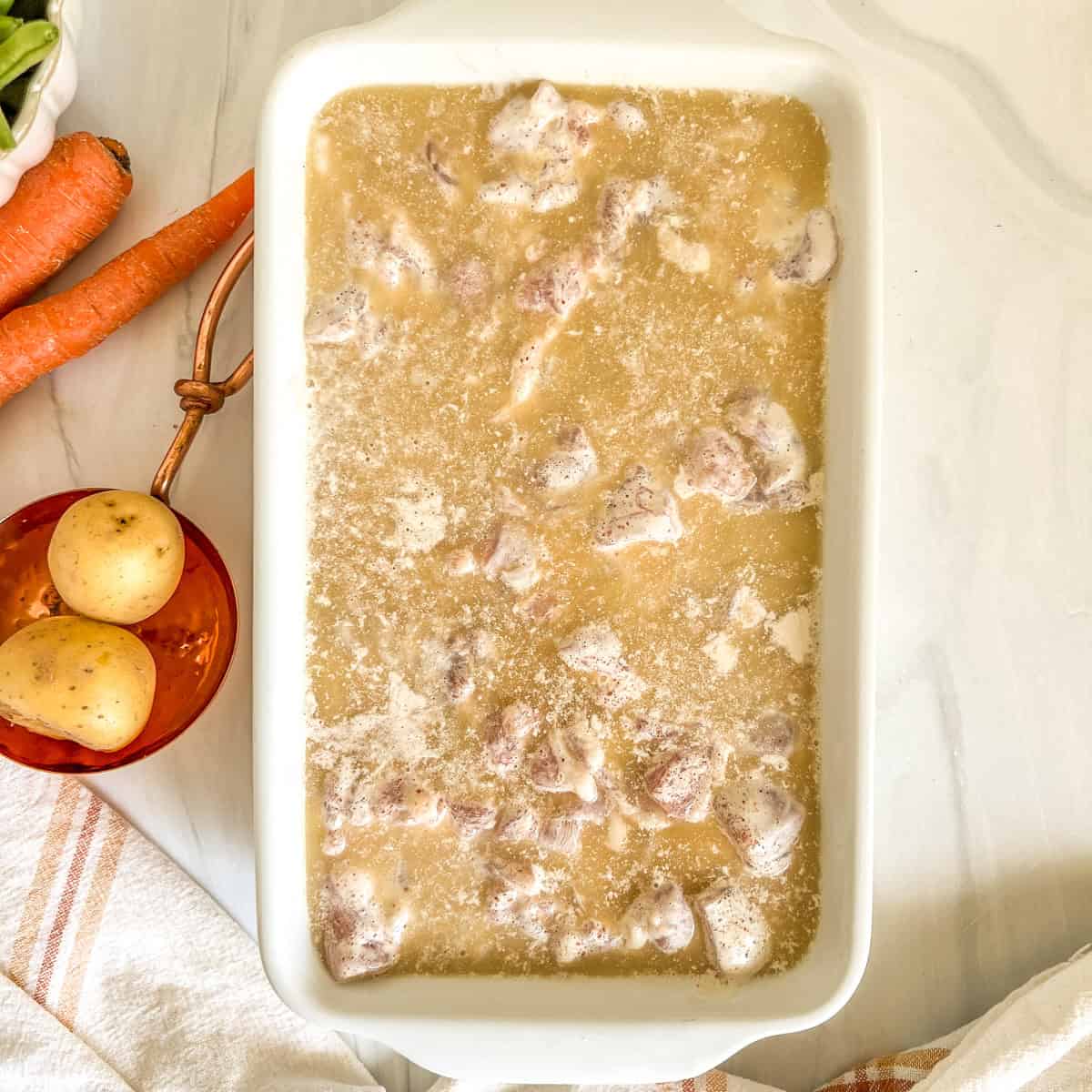 uncooked chicken with rice and broth