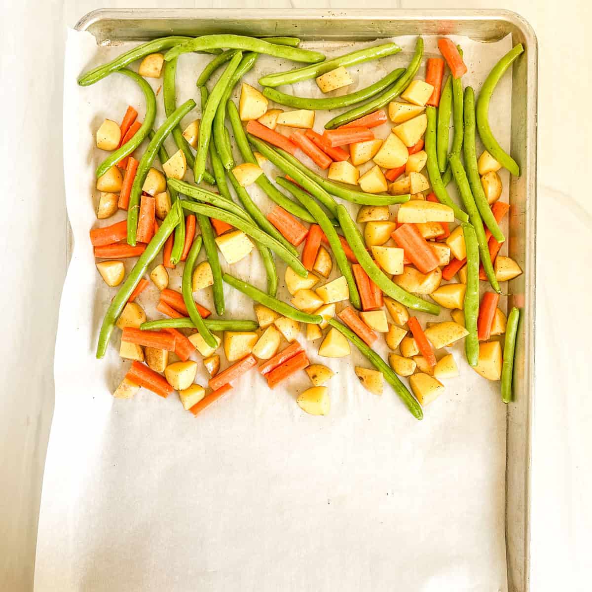 uncooked vegetables on a large pan