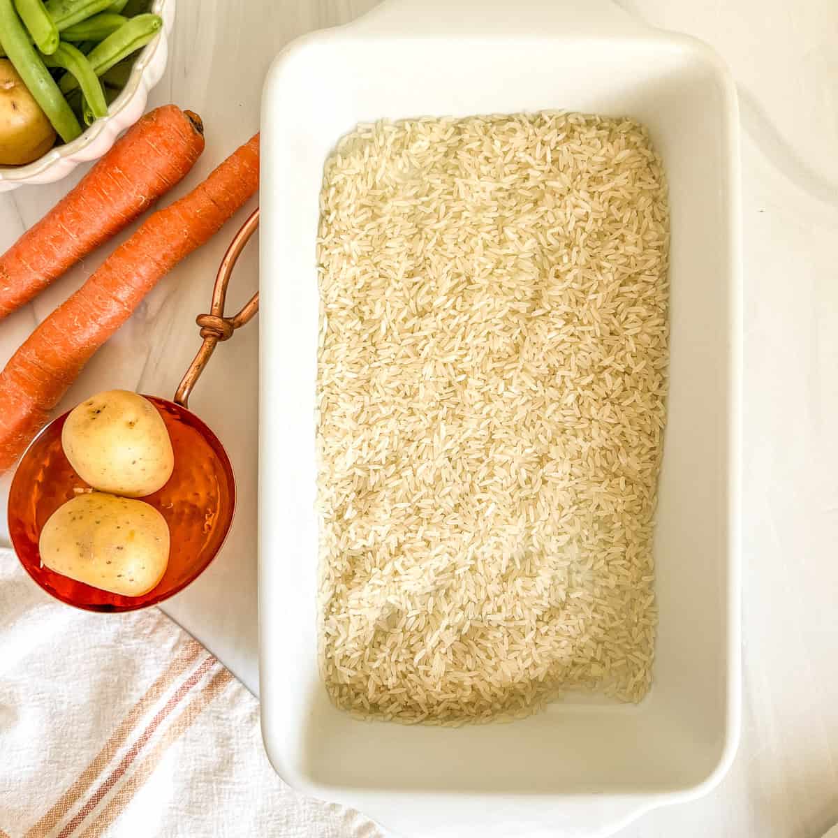 uncooked white rice in a baking dish