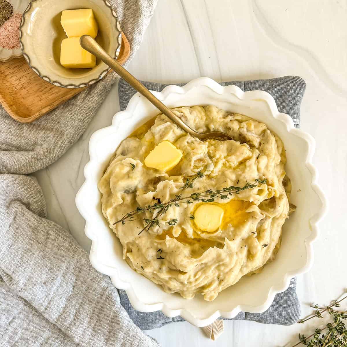 white bowl with slow cooker mashed potatoes