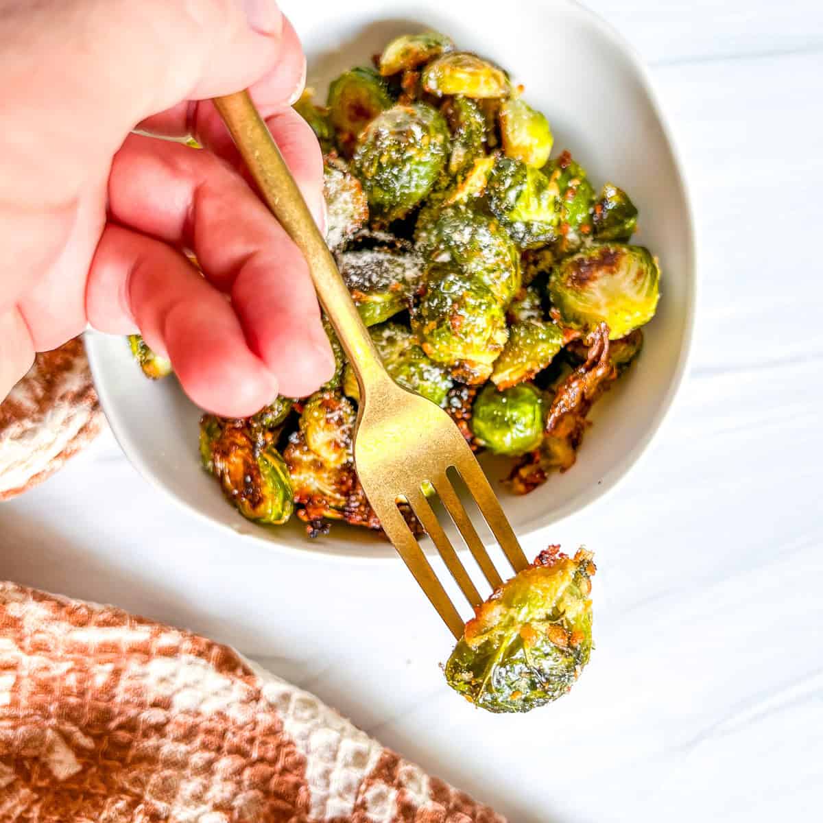 brussel sprout halves on a gold fork