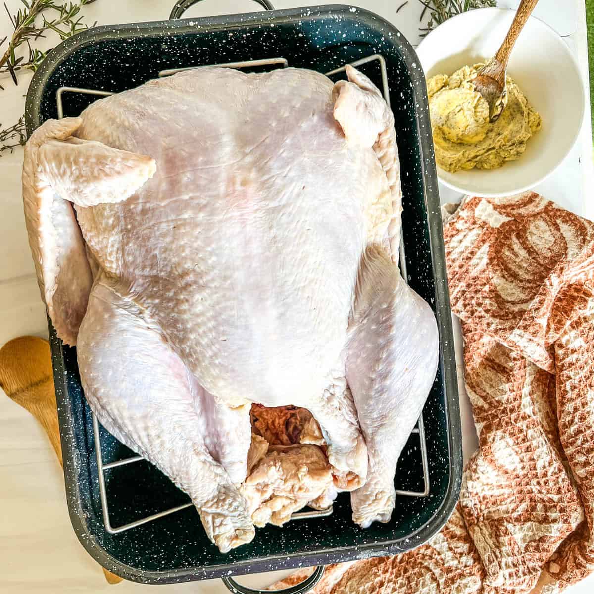 whole turkey with butter in a bowl