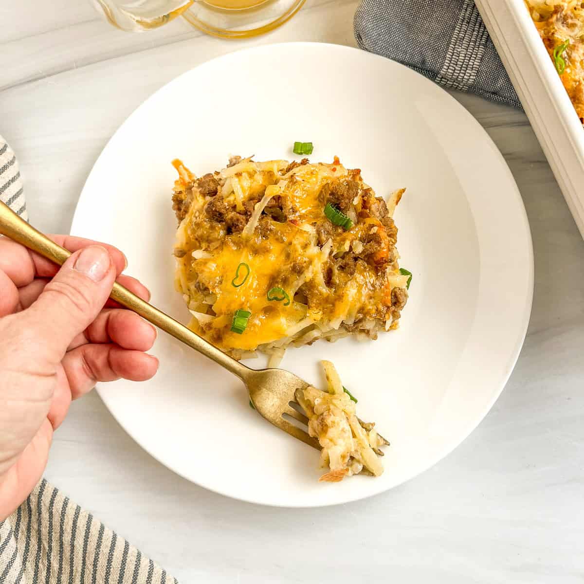 cheesy potato casserole on a fork