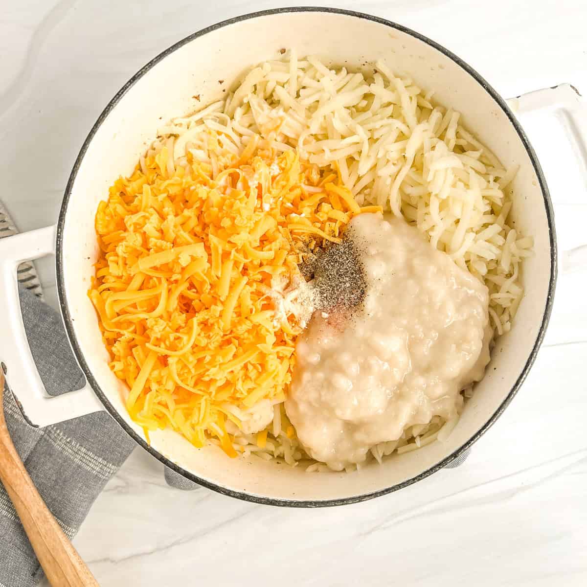hash potatoes, cheese, cream of chicken soup and seasonings in a large pot