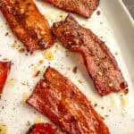 maple syrup on cooked bacon