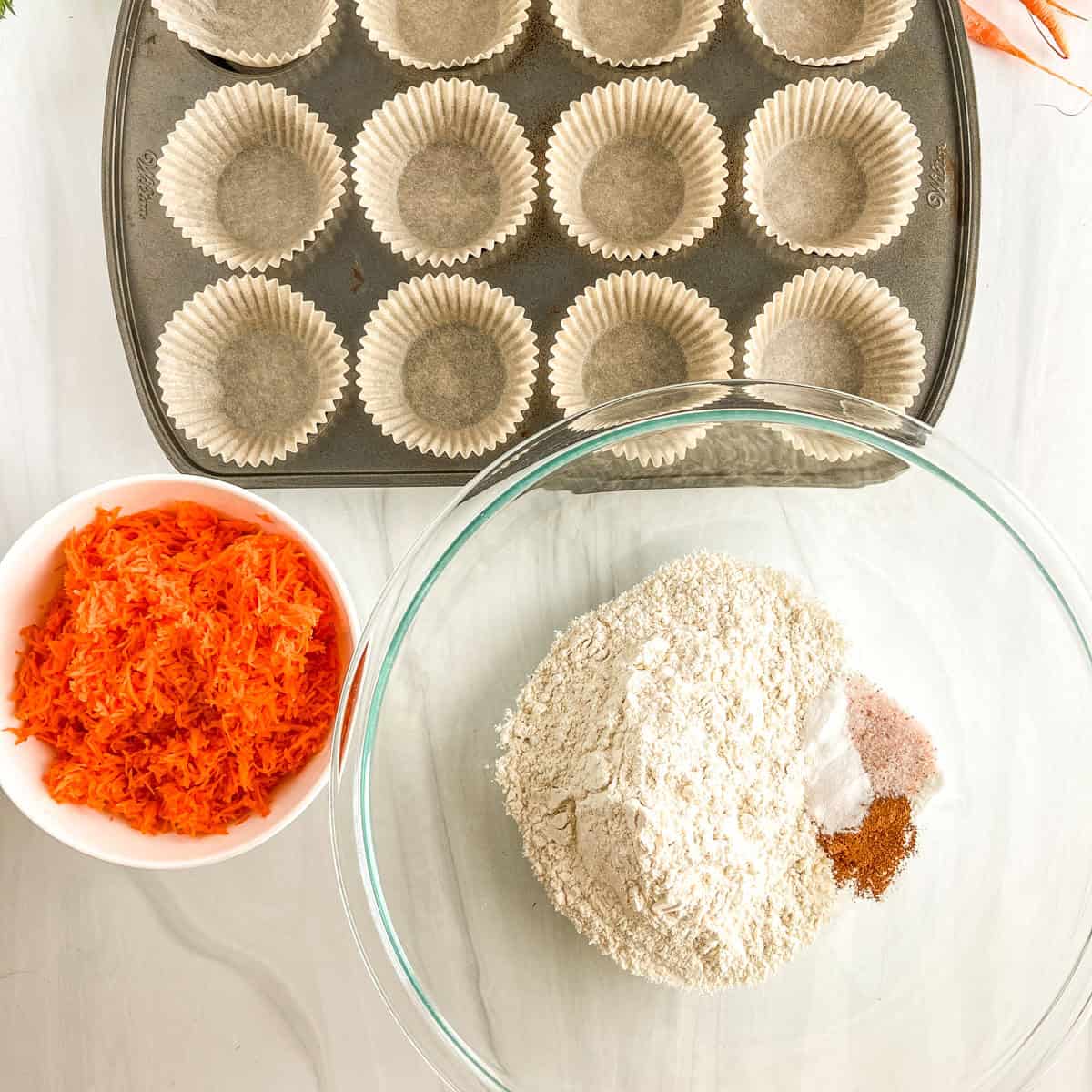 muffin tin, shredded carrots, dry ingredients